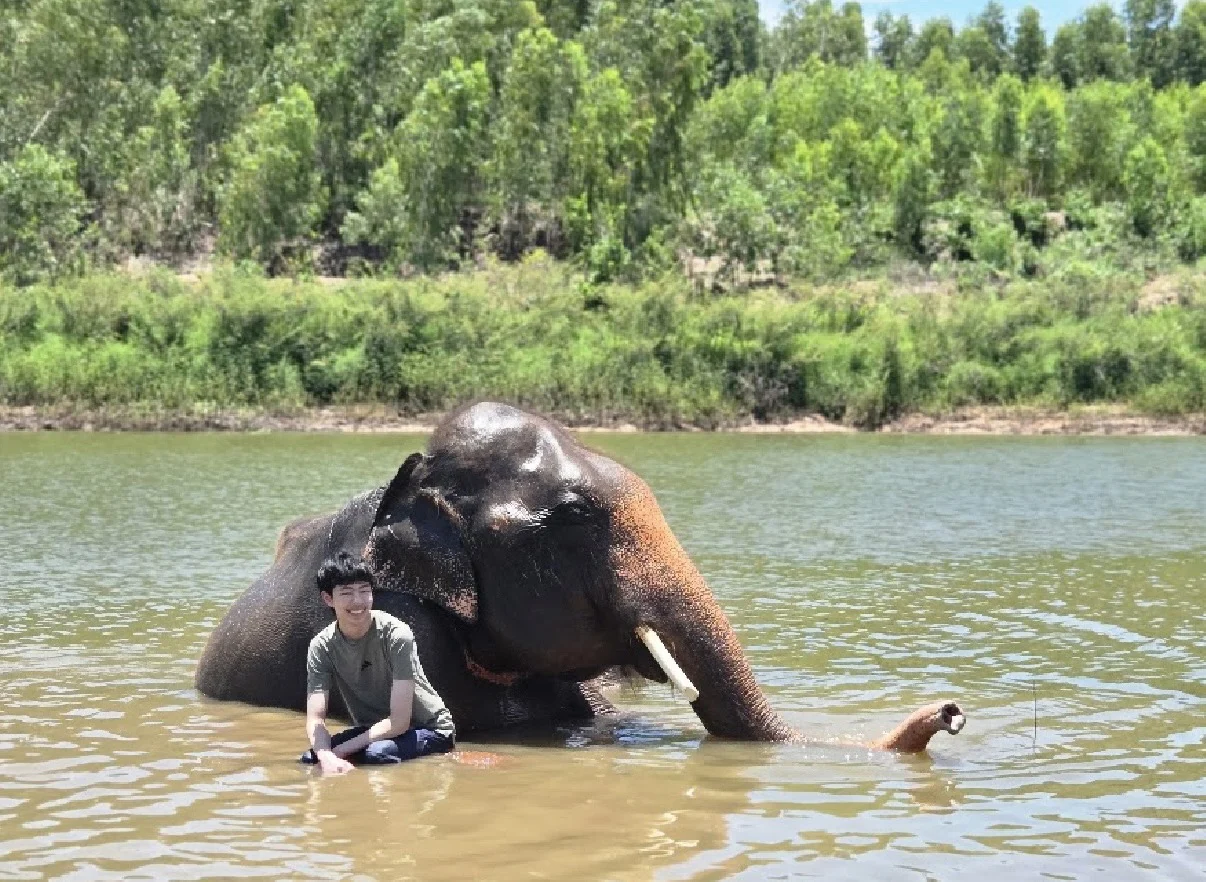 The project founder with an elephant in the water