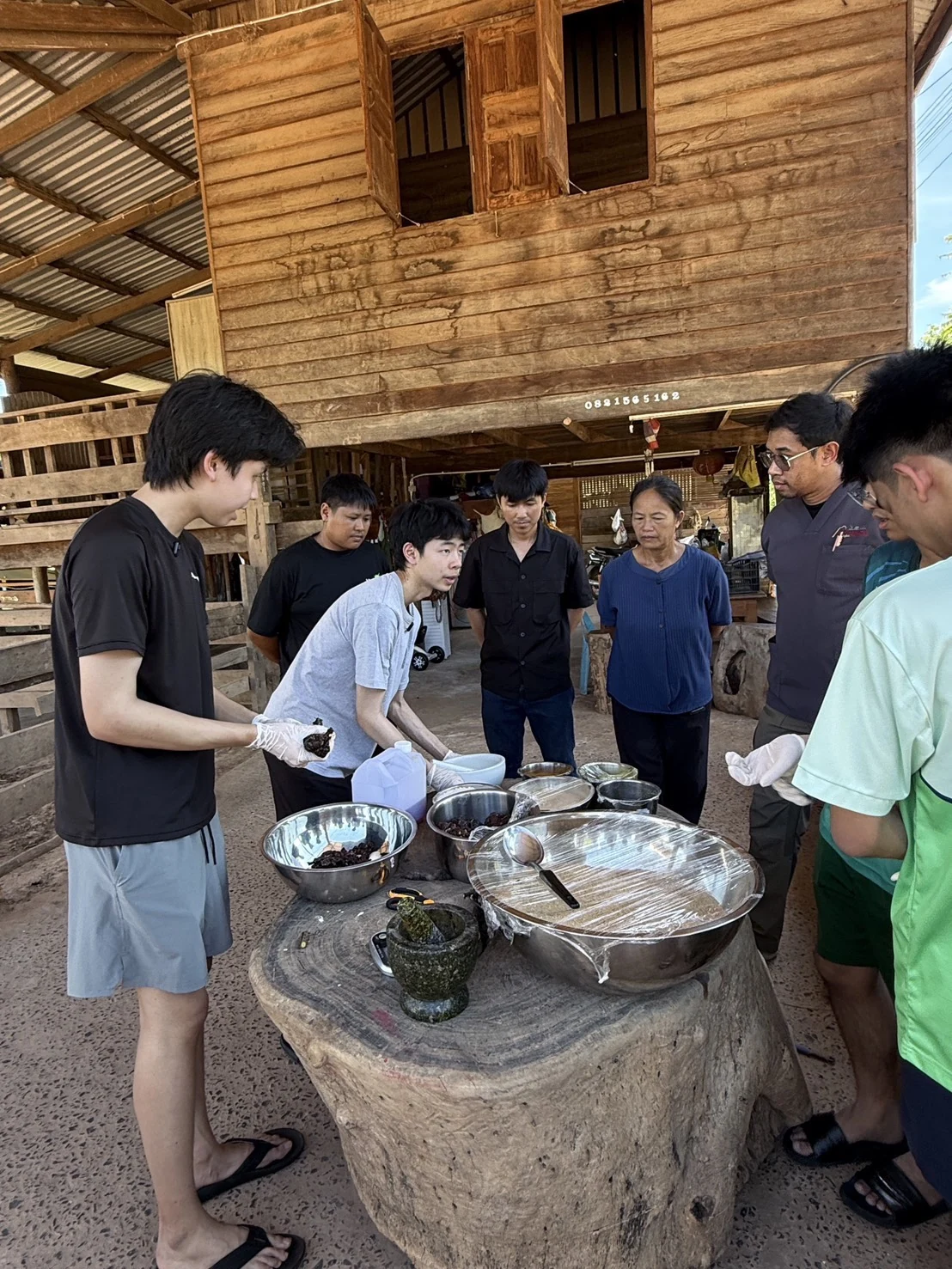 Explaining the ingredients to people gathered around a table
