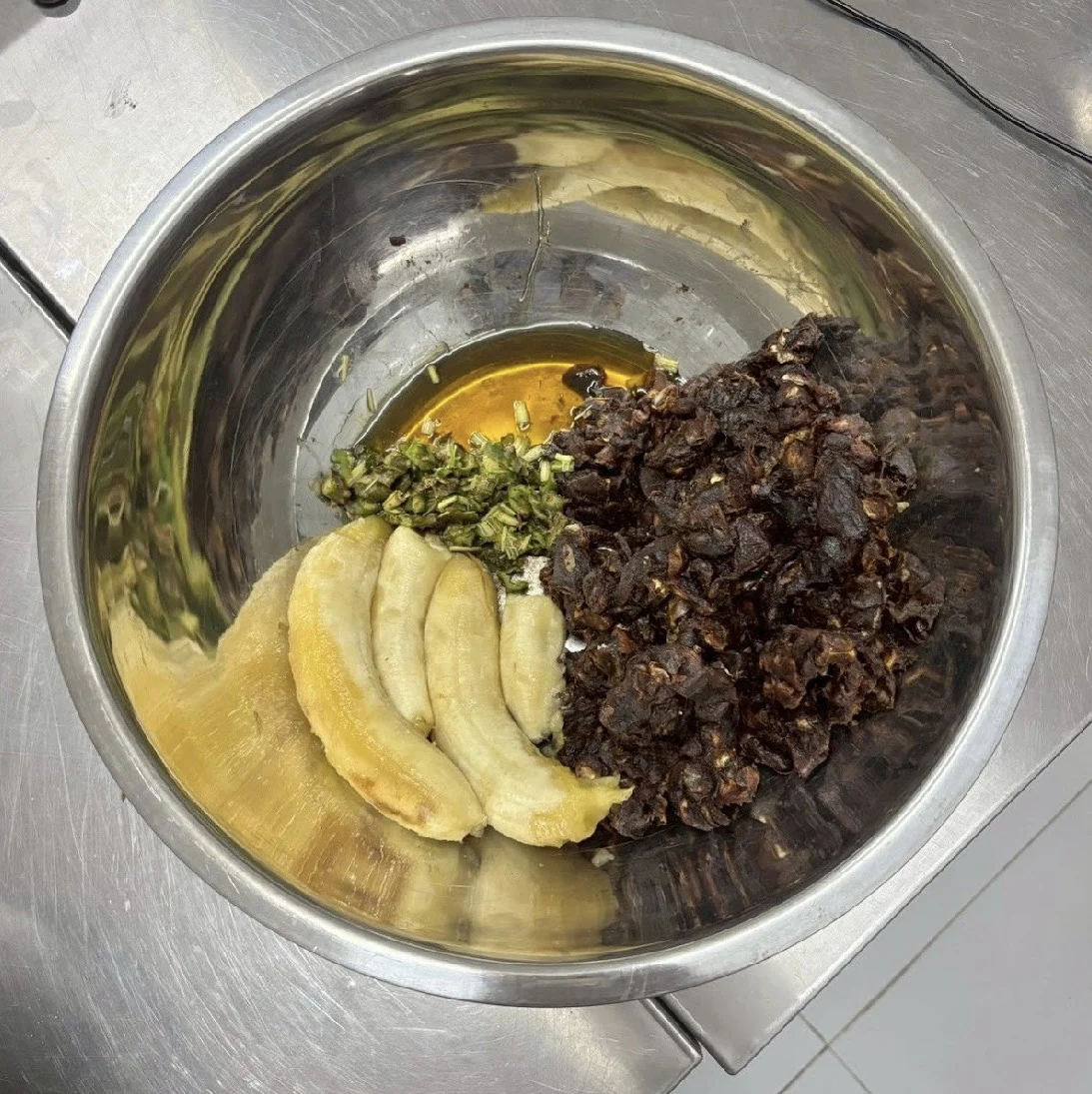 Prepared ingredients with banana in a mixing bowl